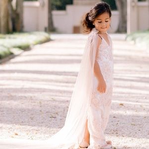 A custom little girls dress plus cape.